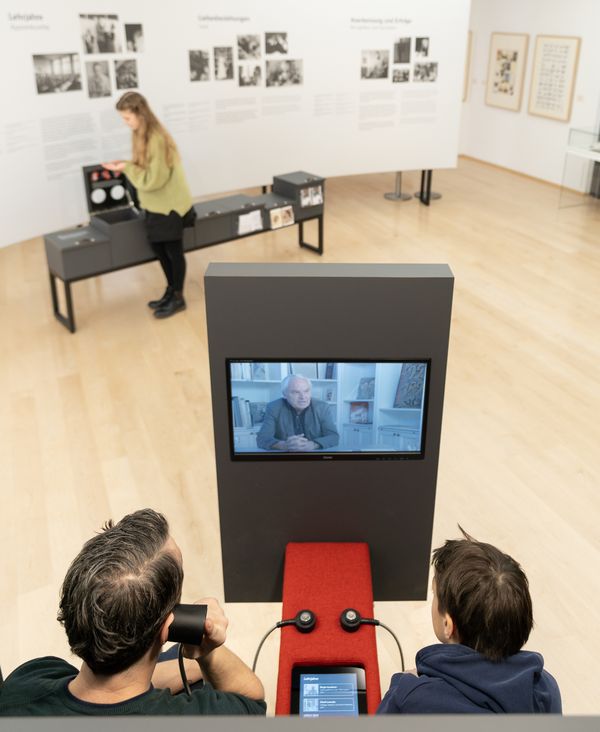 Visitors listen to eyewitness accounts. Photo: Studio 3x3